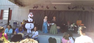 Olaf Elsa and Anna entertaining on stage   